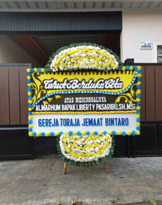 Papan Bunga Duka di Wedomartani